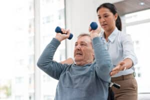Centennial Post Acute rehabilitation specialist working with resident